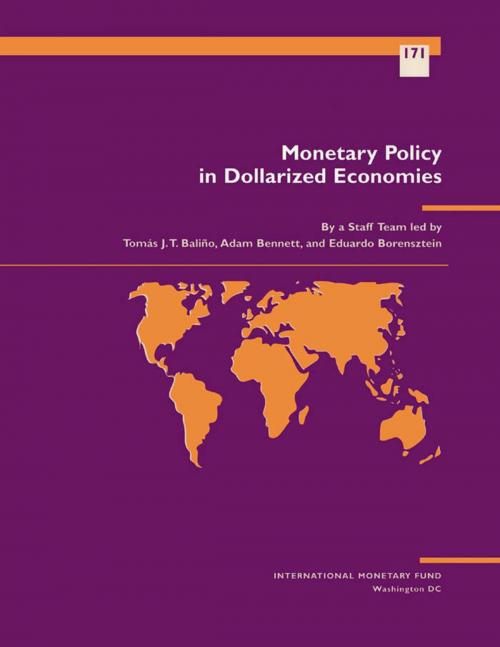 Cover of the book Monetary Policy in Dollarized Economies by Adam Mr. Bennett, Eduardo Mr. Borensztein, Tomás Mr. Baliño, INTERNATIONAL MONETARY FUND