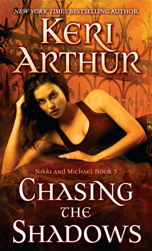 Cover of the book Chasing the Shadows by Keri Arthur, Random House Publishing Group