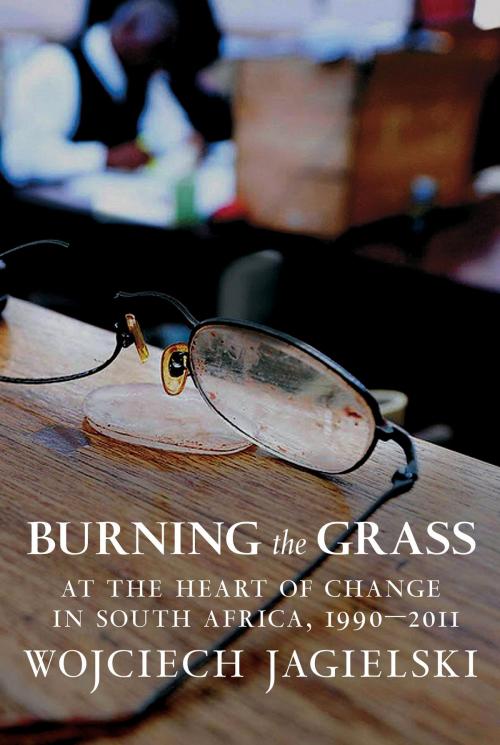 Cover of the book Burning the Grass by Wojciech Jagielski, Seven Stories Press