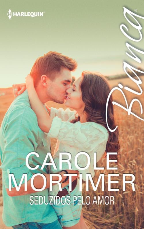 Cover of the book Seduzidos pelo amor by Carole Mortimer, Harlequin, uma divisão de HarperCollins Ibérica, S.A.